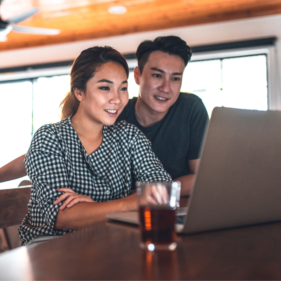 Couple smiling while planning their dream home
