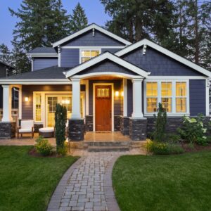 new home with blue siding and wood door