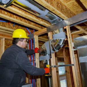man installing new HVAC system
