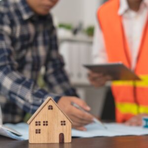 two men reviewing plans for residential construction